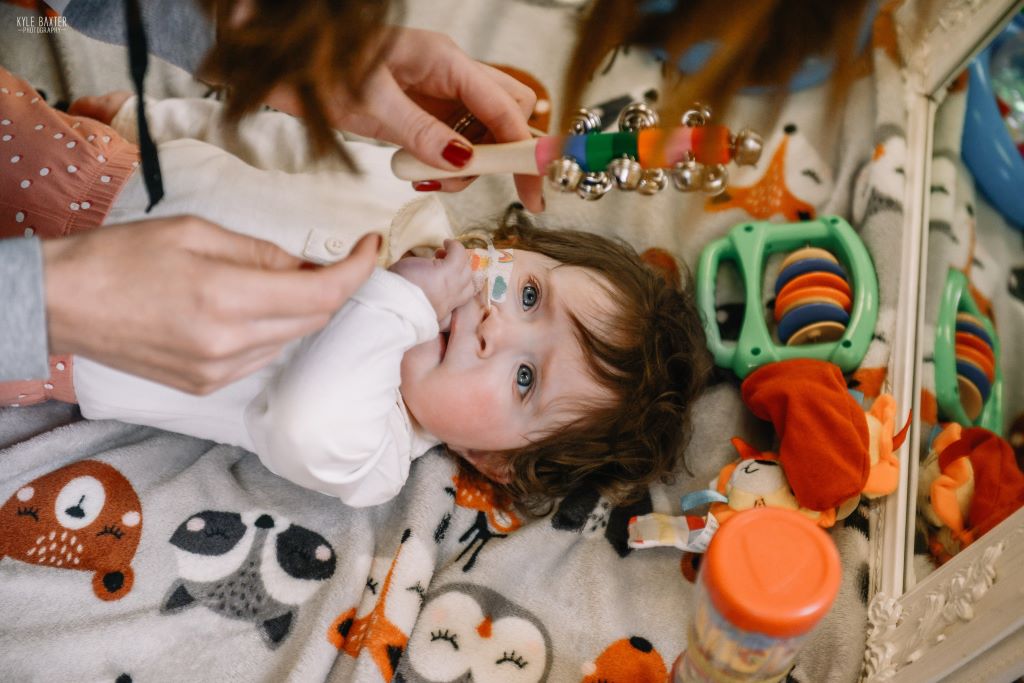 A baby taking part in a sensory activity